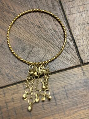 Gold-Tone Twisted Bangle Bracelet with Chain Tassel